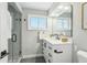 Stylish bathroom features a walk-in glass shower and modern fixtures at 4140 S Inca St, Englewood, CO 80110