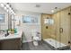 Modern bathroom featuring a glass shower, double vanity, and sleek finishes at 4140 S Inca St, Englewood, CO 80110