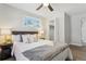 Comfortable bedroom boasts neutral tones, a large window, and ample closet space at 4140 S Inca St, Englewood, CO 80110