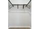 Inside view of a walk-in closet with hanging racks and ample storage space at 4140 S Inca St, Englewood, CO 80110