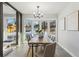 Dining area with bay window, wood table, stylish lighting, and comfortable seating at 4140 S Inca St, Englewood, CO 80110