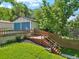 Detached two-car garage with a deck leading to the backyard at 4140 S Inca St, Englewood, CO 80110