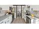Modern kitchen featuring white cabinetry, stainless steel appliances, and stylish backsplash at 4140 S Inca St, Englewood, CO 80110