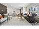 Cozy living room featuring contemporary decor and a fireplace, bathed in natural light at 4140 S Inca St, Englewood, CO 80110