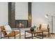 Inviting living area showcasing a modern fireplace, comfortable seating, and stylish decor at 4140 S Inca St, Englewood, CO 80110