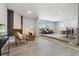 Spacious living area with modern fireplace, large windows, and seamless flow to other rooms at 4140 S Inca St, Englewood, CO 80110