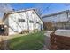 Private backyard with artificial grass, landscaping, and outdoor lighting at 1626 Albion St, Denver, CO 80220