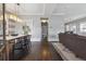 Bright entryway with hardwood floors, modern lighting, and open floor plan at 1626 Albion St, Denver, CO 80220