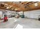 Spacious garage with ample storage, workbench area, and high ceilings at 1626 Albion St, Denver, CO 80220