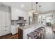 Modern kitchen with granite countertops, stainless steel appliances, and a breakfast bar at 1626 Albion St, Denver, CO 80220
