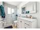 Bright bathroom featuring a glass enclosed shower, marble countertops, and modern fixtures at 7815 Conifer Rd, Denver, CO 80221