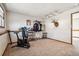 Bedroom showcasing exercise equipment, clothing rack, and unique decorative elements at 7815 Conifer Rd, Denver, CO 80221