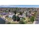 Beautiful aerial view of neighborhood with lush greenery, lake and mountain backdrop at 39 S Scott Dr, Broomfield, CO 80020