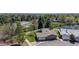 Aerial view showcasing a well-maintained home with a fenced yard, near a pond, in a tranquil neighborhood at 39 S Scott Dr, Broomfield, CO 80020