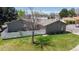 Aerial view of a home with a fenced yard and mature trees at 39 S Scott Dr, Broomfield, CO 80020