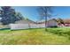 A well-maintained backyard featuring a white picket fence and healthy, green lawn at 39 S Scott Dr, Broomfield, CO 80020