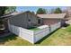 Cozy fenced-in backyard with a small patio area and well-maintained lawn, perfect for outdoor relaxation at 39 S Scott Dr, Broomfield, CO 80020