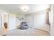 A well-lit bedroom with two large closets and a seating area at 39 S Scott Dr, Broomfield, CO 80020
