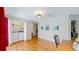 Bedroom with hardwood floors, laundry access, desk area, and closet space at 39 S Scott Dr, Broomfield, CO 80020