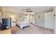 Bright bedroom with carpet flooring, ceiling fan, ensuite bathroom, and closet at 39 S Scott Dr, Broomfield, CO 80020