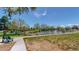 Scenic community view with a bench overlooking a serene pond surrounded by lush greenery at 39 S Scott Dr, Broomfield, CO 80020