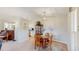 Cozy dining area with a wooden table and view to the kitchen at 39 S Scott Dr, Broomfield, CO 80020