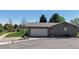 Well-kept home exterior with a two-car garage, manicured landscaping, and a welcoming driveway at 39 S Scott Dr, Broomfield, CO 80020