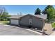Exterior image of a house featuring a large garage door and manicured landscaping at 39 S Scott Dr, Broomfield, CO 80020