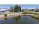 Serene pond view with a walking path, bench, and well-maintained landscaping; perfect spot for relaxation at 39 S Scott Dr, Broomfield, CO 80020