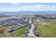 Aerial view of the neighborhood highlighting the homes and the community's layout with a large lake at 437 Buckskin Rd, Berthoud, CO 80513