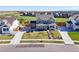 Wide aerial perspective of a stylish home showcasing its large yard and community setting at 437 Buckskin Rd, Berthoud, CO 80513