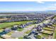 A high angle aerial shot of the neighborhood showcases the homes and distant mountain views at 437 Buckskin Rd, Berthoud, CO 80513