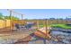 Landscaped backyard oasis with a swing, seating, bridge and tranquil pond at 437 Buckskin Rd, Berthoud, CO 80513