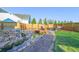 Beautiful backyard with pond, bridge and landscaping at 437 Buckskin Rd, Berthoud, CO 80513