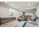 Finished basement features an entertainment area, a seating area, and a pool table at 437 Buckskin Rd, Berthoud, CO 80513