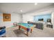 Finished basement features a pool table, entertainment area, and space for recreation and relaxation at 437 Buckskin Rd, Berthoud, CO 80513