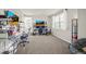 Well-lit bedroom with carpeted floors, large windows, and versatile space for gaming, relaxing, or bedroom set at 437 Buckskin Rd, Berthoud, CO 80513