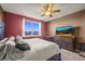 Bedroom with large bed, ceiling fan, and view of exterior at 437 Buckskin Rd, Berthoud, CO 80513