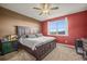 Bedroom with large bed, ceiling fan, and view of exterior at 437 Buckskin Rd, Berthoud, CO 80513