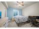 This bedroom features a comfortable bed, a window, and a ceiling fan at 437 Buckskin Rd, Berthoud, CO 80513