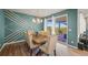 Elegant dining room with stylish chairs, chandelier, and sliding door to patio at 437 Buckskin Rd, Berthoud, CO 80513
