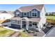 Charming two-story home featuring a cozy front porch and manicured landscaping at 437 Buckskin Rd, Berthoud, CO 80513