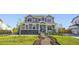 Beautiful home with stone accents, manicured lawn, and charming front porch at 437 Buckskin Rd, Berthoud, CO 80513