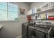 Laundry room with side by side front load washer and dryer at 437 Buckskin Rd, Berthoud, CO 80513
