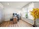 Bright home office featuring wood floors, a large window, and a work area at 437 Buckskin Rd, Berthoud, CO 80513