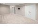 Spacious basement with plush carpeting, neutral walls, and double door closet at 6147 Dunraven, Golden, CO 80403