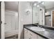 Bathroom featuring a vanity with a large mirror and a combined bathtub and shower at 2740 W 86Th Ave # 186, Westminster, CO 80031