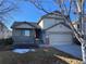 Charming two-story home with a two-car garage and covered front porch at 10067 Idalia St, Commerce City, CO 80022