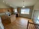 Eat in kitchen with wood floors, island and lots of natural light at 10067 Idalia St, Commerce City, CO 80022