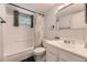 Bathroom featuring a shower-tub combination and a vanity with sink at 4653 S Lowell Blvd # E, Denver, CO 80236